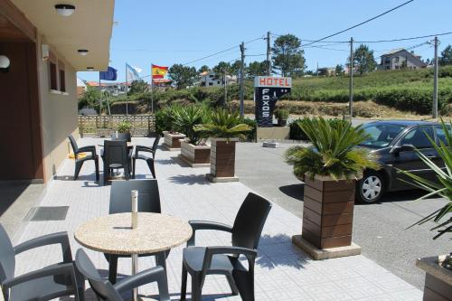 Un restaurante o sitio para comer en Hotel Foxos