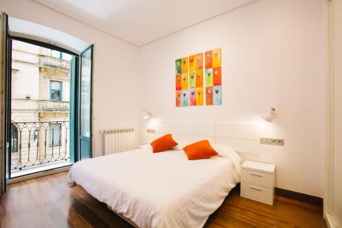Posteľ alebo postele v izbe v ubytovaní Apartamentos San Marcial 28