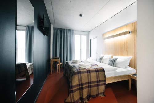 Postel nebo postele na pokoji v ubytování Hotel Rossi