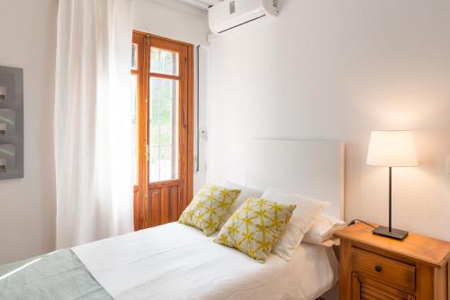 Posteľ alebo postele v izbe v ubytovaní Mundo Nuevo: Acogedor Apartamento en el Centro