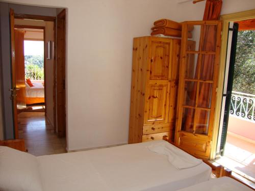 Ένα ή περισσότερα κρεβάτια σε δωμάτιο στο Ipsia Apartments 