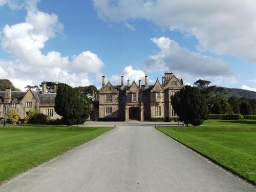 a large house with a driveway in front of it at Ros Villa Guesthouse in Killarney