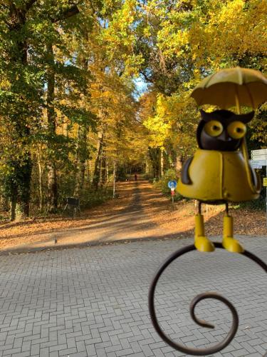 a cartoon character holding a tennis racket in a park at Hotel Bentheimer Hof in Bad Bentheim