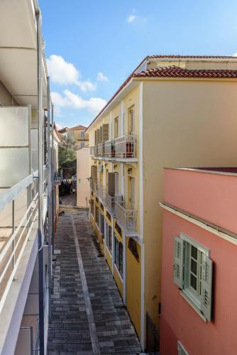 an alley between two buildings in a city at Agamemnon Hotel in Nafplio