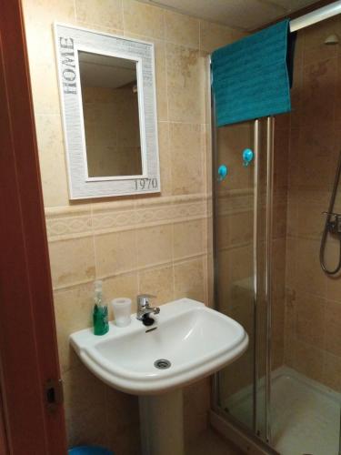 a bathroom with a sink and a shower at Manilva Playa in Manilva