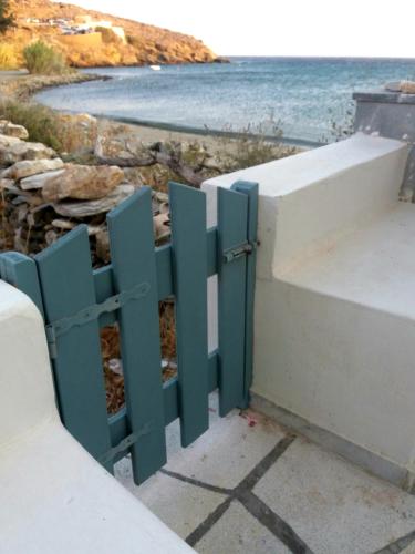 a gate to the beach with the ocean behind it at ''Sea front'' Rose's house in Kardiani
