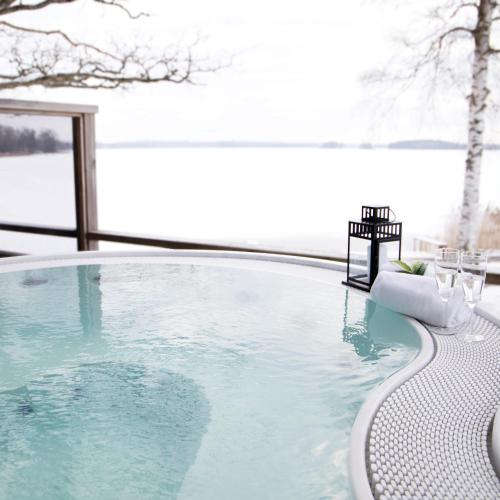 a swimming pool with a view of the water at Tingsryd Resort in Tingsryd