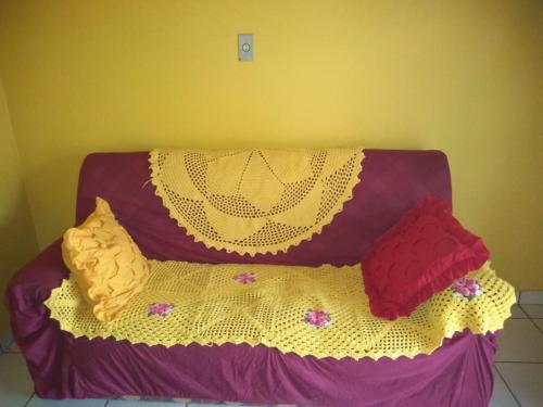 a purple bed with pillows on top of it at Pousada União Tavares in Mateiros