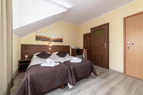 Postel nebo postele na pokoji v ubytování Dom Jastrzębia z basenem i jacuzzi