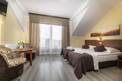 Postel nebo postele na pokoji v ubytování Dom Jastrzębia z basenem i jacuzzi