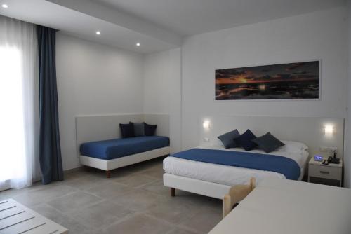 Postel nebo postele na pokoji v ubytování Hotel Belsito