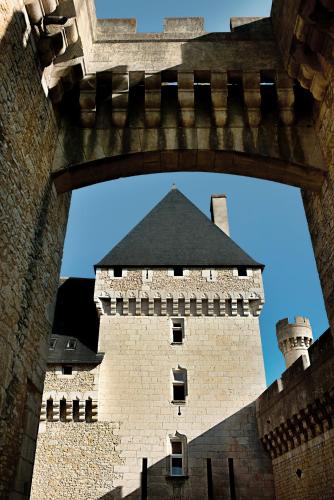 a view of a castle through an archway at Hapimag Château de Chabenet in Chabenet