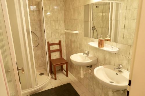 a bathroom with a sink and a toilet and a shower at Chata U Zmrzlyho in Vrchlabí