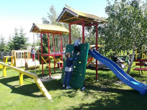 a child on a slide at a playground at Andreyevskie Ozera in Andreyevka