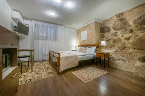 Postel nebo postele na pokoji v ubytování Kesminta Apartments