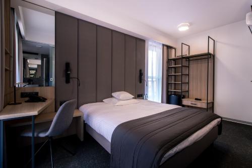 Кровать или кровати в номере Bulvar Hotel