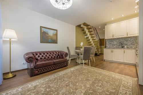 a living room with a couch and a table at Kesminta Apartments in Vilnius