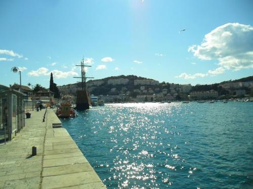 a view of a body of water with a pier at Apartments Grebović in Dubrovnik