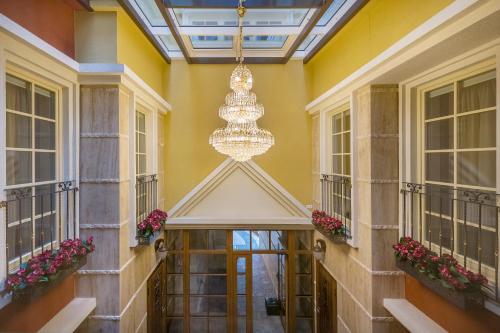 a hallway of a building with a chandelier at Kesminta Apartments in Vilnius