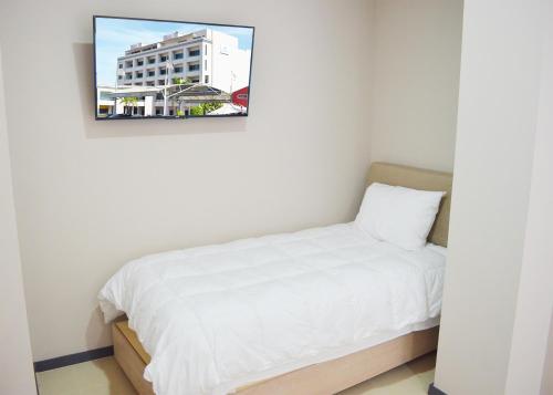 Ένα ή περισσότερα κρεβάτια σε δωμάτιο στο Bahia Marina Departamentos
