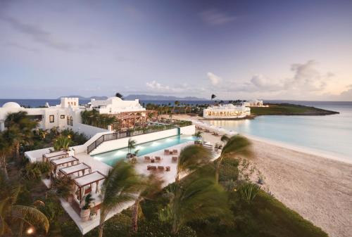 an aerial view of a resort with a pool and a beach at Cap Juluca, A Belmond Hotel, Anguilla in West End Village