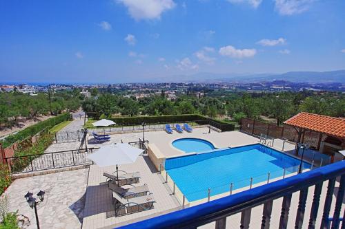 a view of a swimming pool on a balcony at Villa Mandola Rosa in Prodhromi