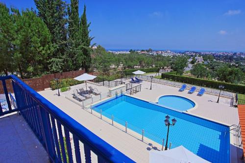 a large swimming pool on top of a balcony at Villa Mandola Rosa in Prodhromi