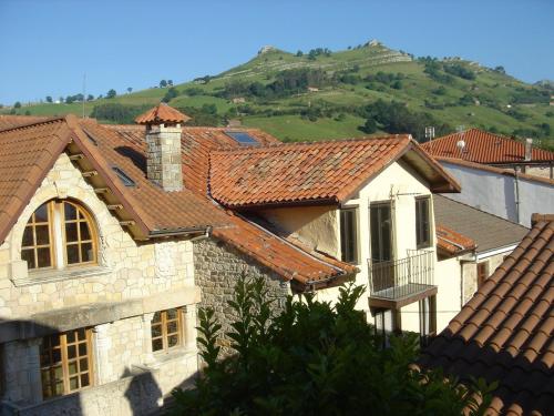 a group of houses with hills in the background at Posada Carpe Diem in Liérganes