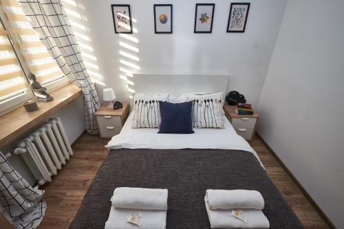 Posteľ alebo postele v izbe v ubytovaní Noctis Apartment Pańska II