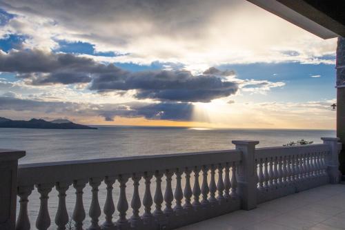 a view of the ocean from a balcony at 360 Splendor Del Pacifico Residences in Playa Flamingo