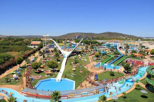 an amusement park with a pool and a water park at Quarteira Beach in Quarteira