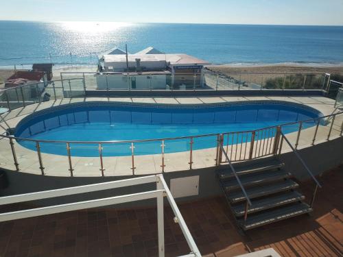 Islantilla-Apartamento con piscina y garaje en primera linea de playa