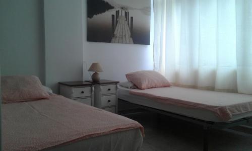 A bed or beds in a room at Apartment close to Yumbo,Free parking