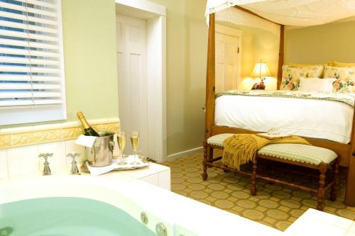 a bathroom with a bed and a bath tub at Channel Road Inn, A Four Sisters Inn in Los Angeles
