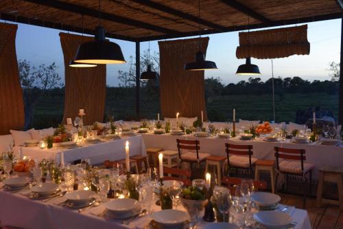 a table set up for a wedding with candles at Pensão Agrícola in Cabanas de Tavira