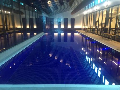 a large swimming pool in a building at Large 2B2B Near Southern Cross FreeParking GYM POOL in Melbourne