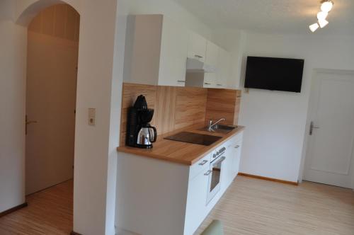 a kitchen with a sink and a counter top at Ferienwohnungen Familie Jarnig Inge in Görtschach