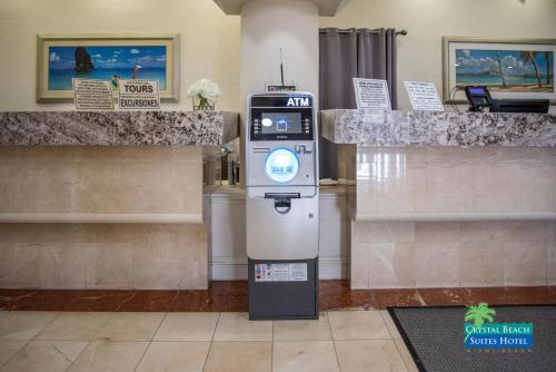 a atm machine in a lobby of a building at Crystal Beach Suites Miami Oceanfront Hotel in Miami Beach