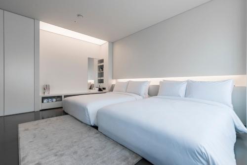 Ein Bett oder Betten in einem Zimmer der Unterkunft Hotel Cappuccino