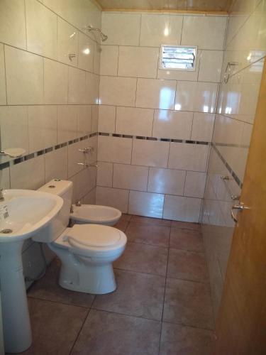 a bathroom with a toilet and a sink and a shower at Casa VillaOliva in Ciudad Lujan de Cuyo
