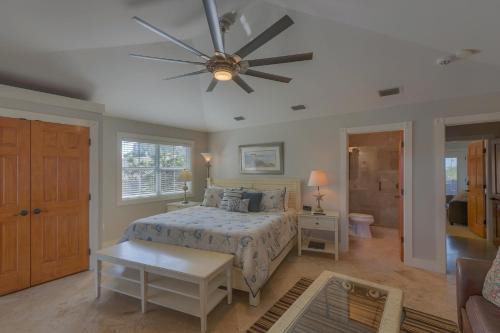 a bedroom with a bed and a ceiling fan at Cape San Blas Inn in Indian Pass
