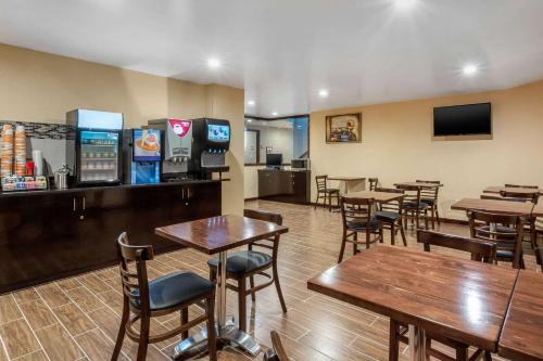 a restaurant with tables and chairs and a bar at The L Hotel in Brooklyn
