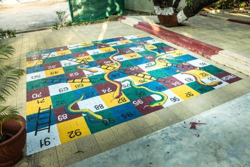 a colorful tile floor with a snake on it at Ras Resort By Treat Silvassa in Silvassa