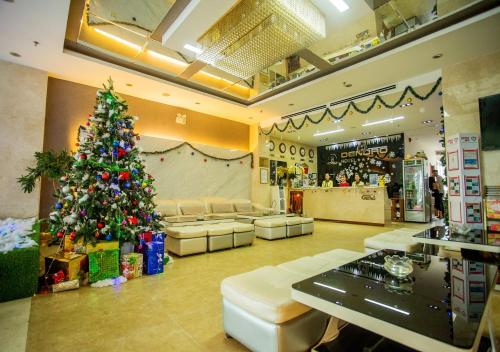 a christmas tree in the middle of a store at Dendro beachfront Hotel in Nha Trang