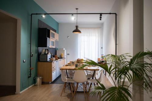 a kitchen with a table and chairs in a room at Panoramica dei Templi B&B in Agrigento