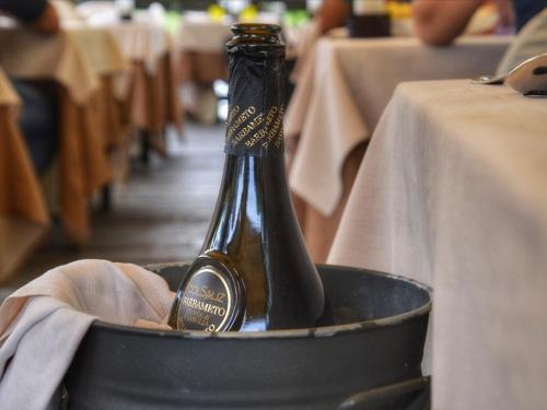a bottle of beer sitting in a bucket at Villa Goetzen in Dolo