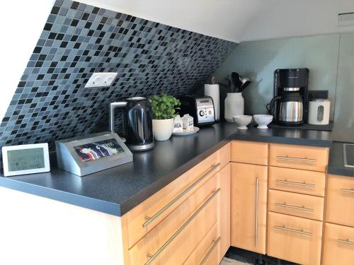 a kitchen with a counter top with a coffee maker at Ankerplatz Güby in Güby