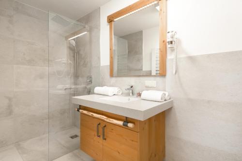 a bathroom with a sink and a shower at Stockhambauer in Kleinarl
