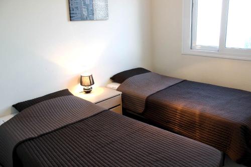 Ένα ή περισσότερα κρεβάτια σε δωμάτιο στο Valle Romano Capitolio Dos