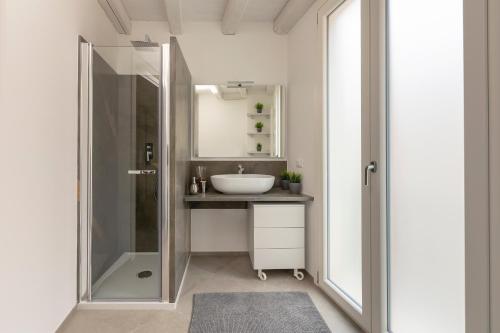 a bathroom with a sink and a shower at Le Cupole Suites & Apartments in Trapani